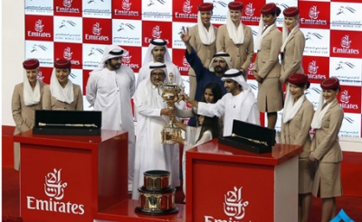 H.H. Sheikh Mohammed bin Rashid receives the Dubai World Cup from H.H. Sheikh Hamdan Bin Rashid